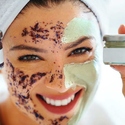 a person is holding up two jars of face masks