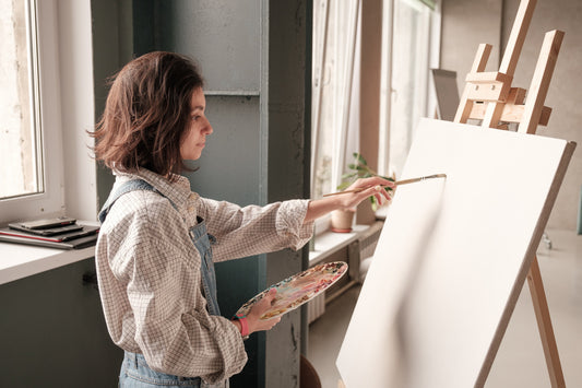 Student doing a Acrylic painting in art class