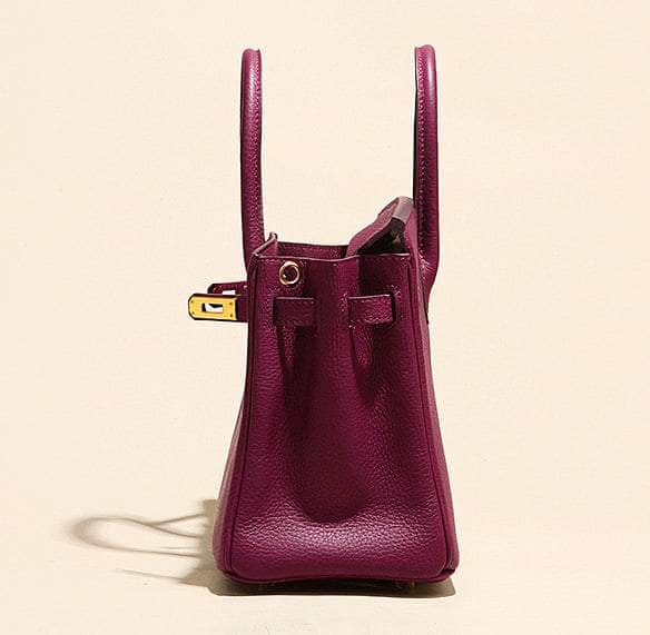 Chic Bordeaux Handbag Embellished with Gleaming Gold Features