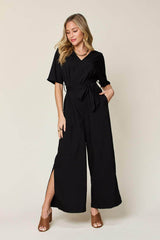 Double Take Full Size V-Neck Tie Front Short Sleeve Slit Jumpsuit Black / S