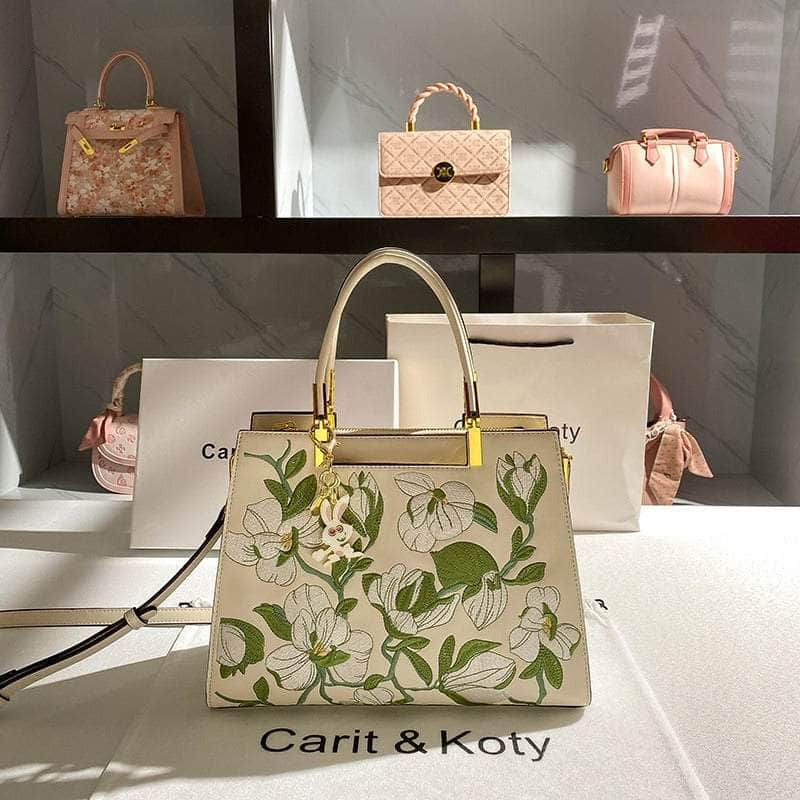 Elegant Crossbody Leather Handbag with Flowery Detail