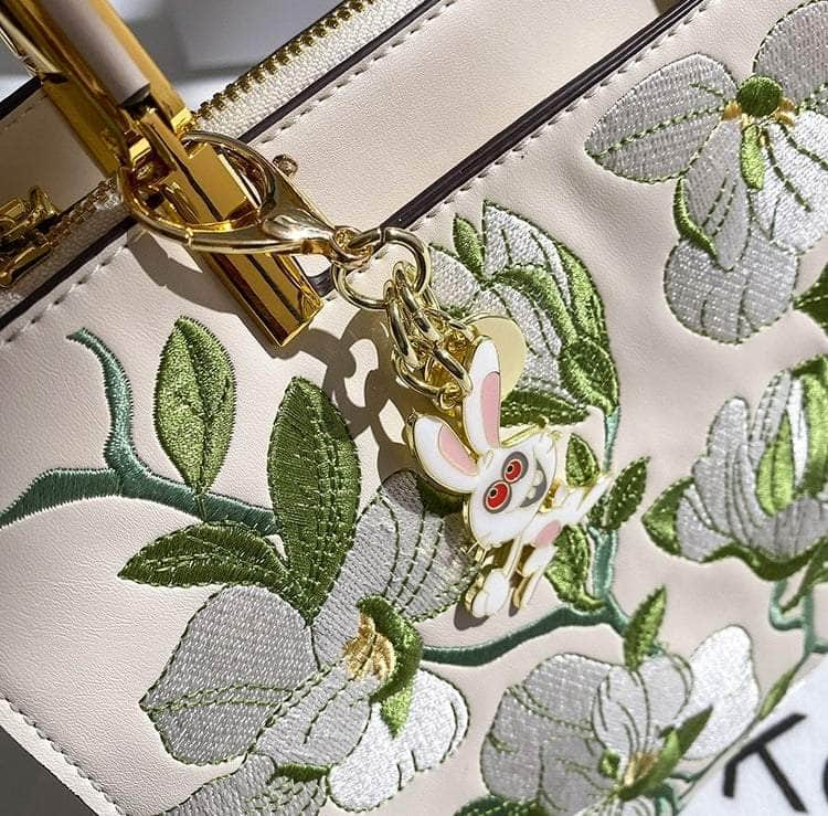 Elegant Crossbody Leather Handbag with Flowery Detail