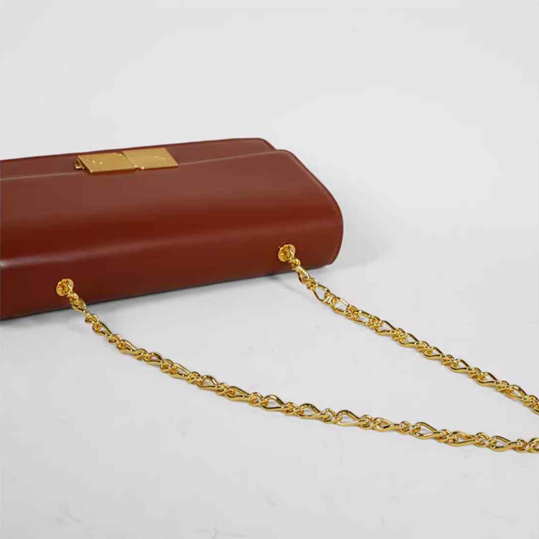 Gleaming Metal Buckle Accented Chain Shoulder Bag