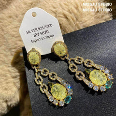 Shimmery Crackle Glass Paved Crystal Earrings Yellow