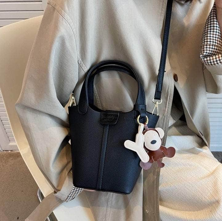 Sleek Crossbody Bucket Bag with Bear Charm