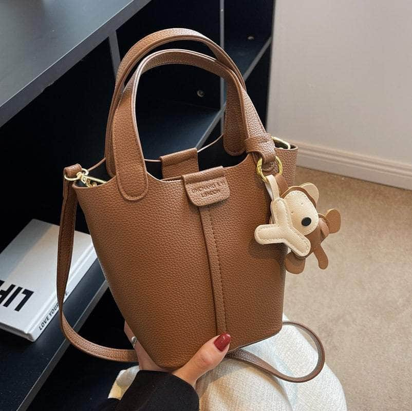 Sleek Crossbody Bucket Bag with Bear Charm