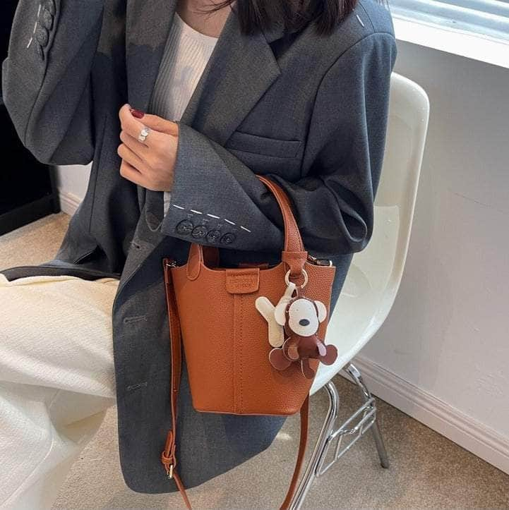 Sleek Crossbody Bucket Bag with Bear Charm