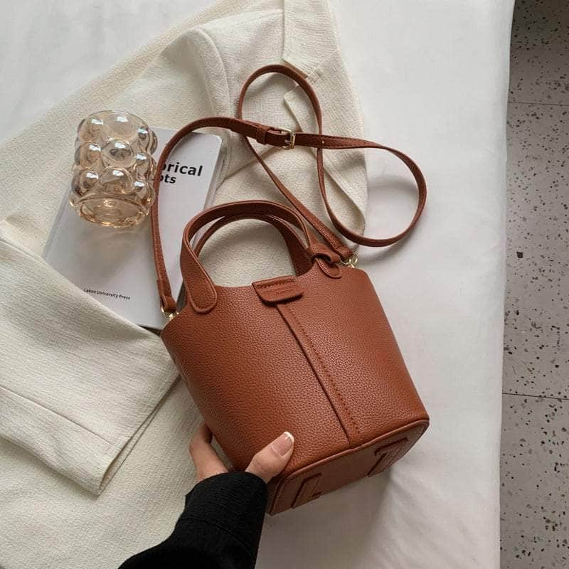 Sleek Crossbody Bucket Bag with Bear Charm