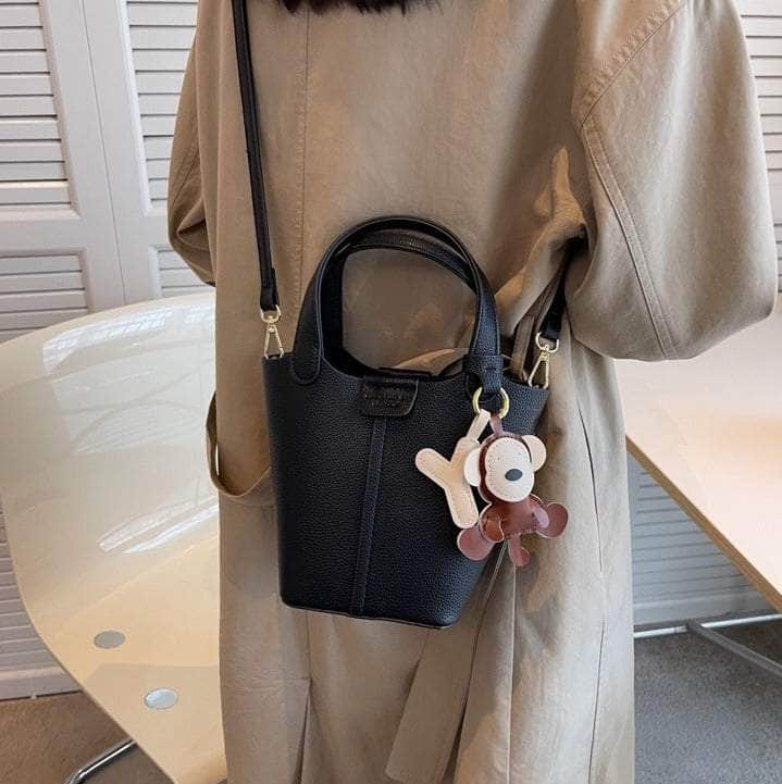 Sleek Crossbody Bucket Bag with Bear Charm