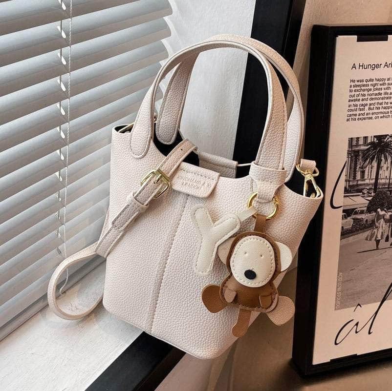 Sleek Crossbody Bucket Bag with Bear Charm