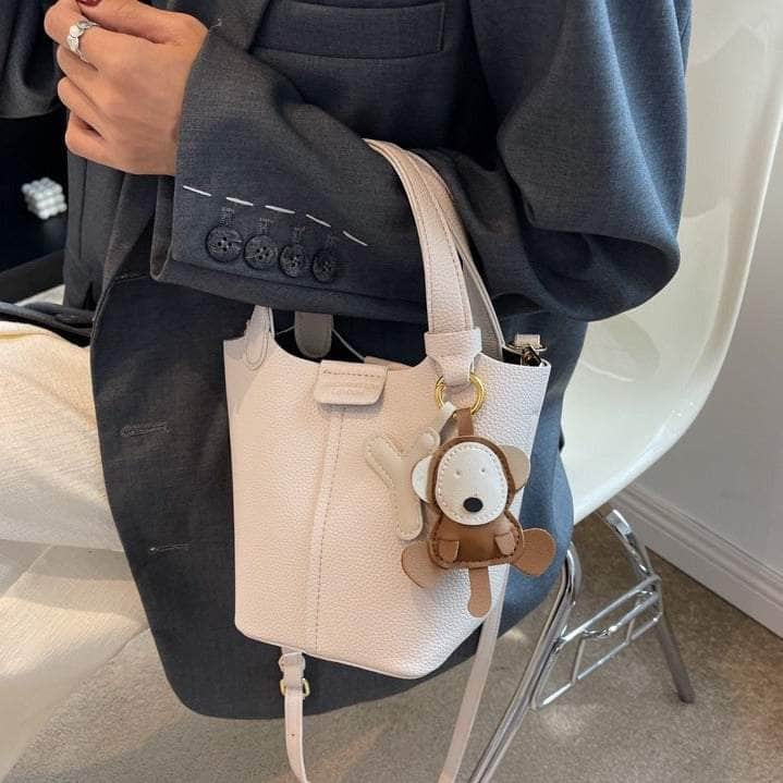 Sleek Crossbody Bucket Bag with Bear Charm