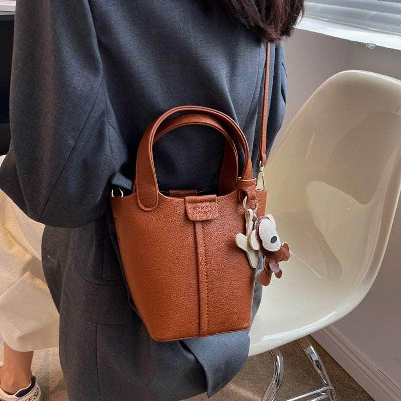 Sleek Crossbody Bucket Bag with Bear Charm