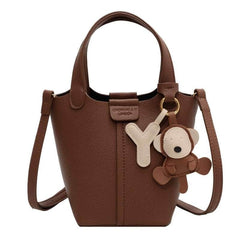 Sleek Crossbody Bucket Bag with Bear Charm