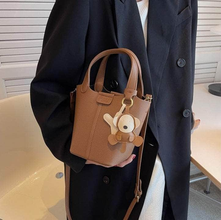 Sleek Crossbody Bucket Bag with Bear Charm