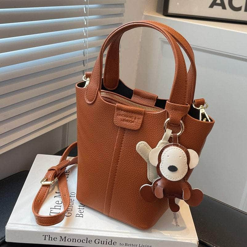 Sleek Crossbody Bucket Bag with Bear Charm