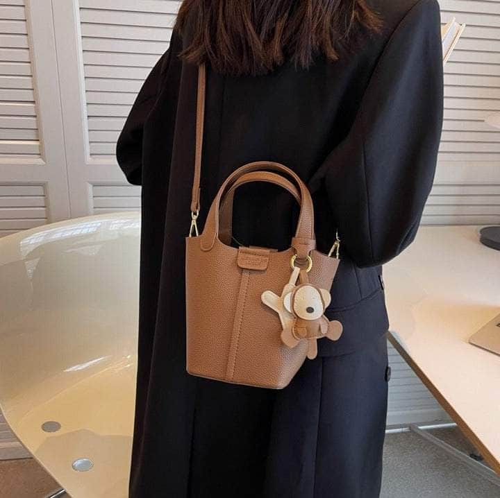 Sleek Crossbody Bucket Bag with Bear Charm