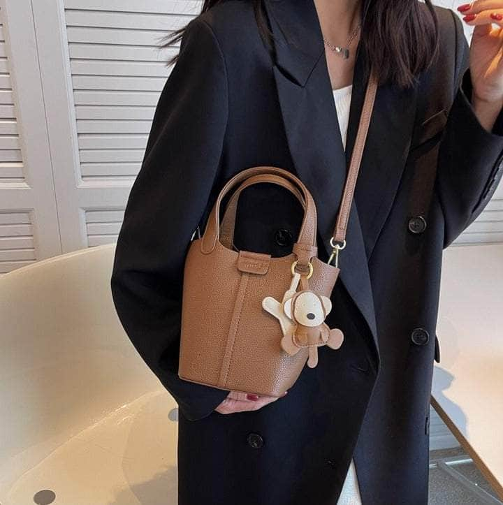 Sleek Crossbody Bucket Bag with Bear Charm