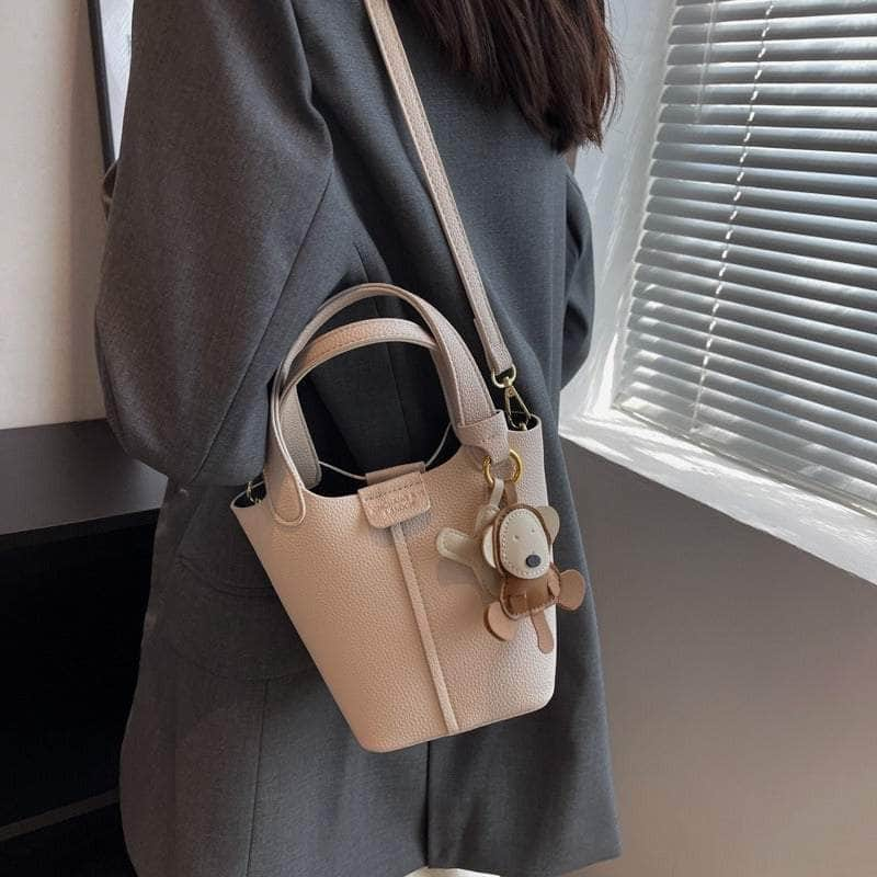 Sleek Crossbody Bucket Bag with Bear Charm