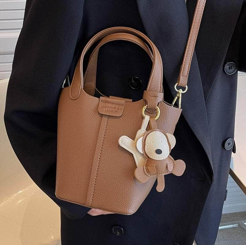 Sleek Crossbody Bucket Bag with Bear Charm