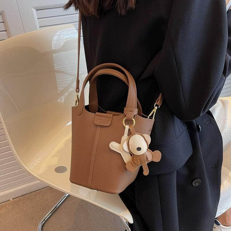 Sleek Crossbody Bucket Bag with Bear Charm