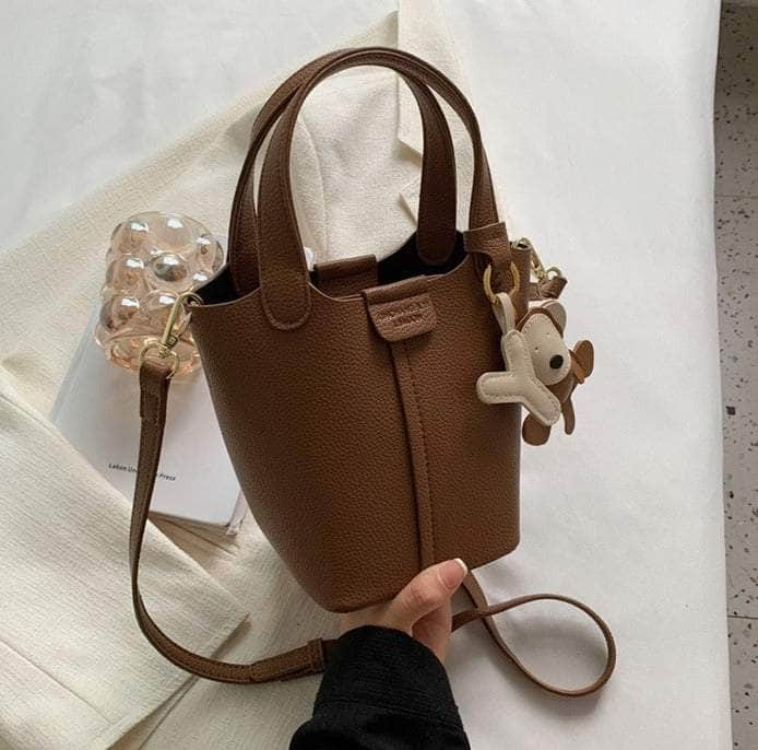 Sleek Crossbody Bucket Bag with Bear Charm Brown