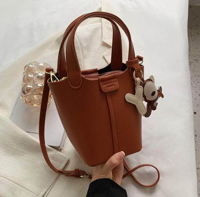 Sleek Crossbody Bucket Bag with Bear Charm Caramel