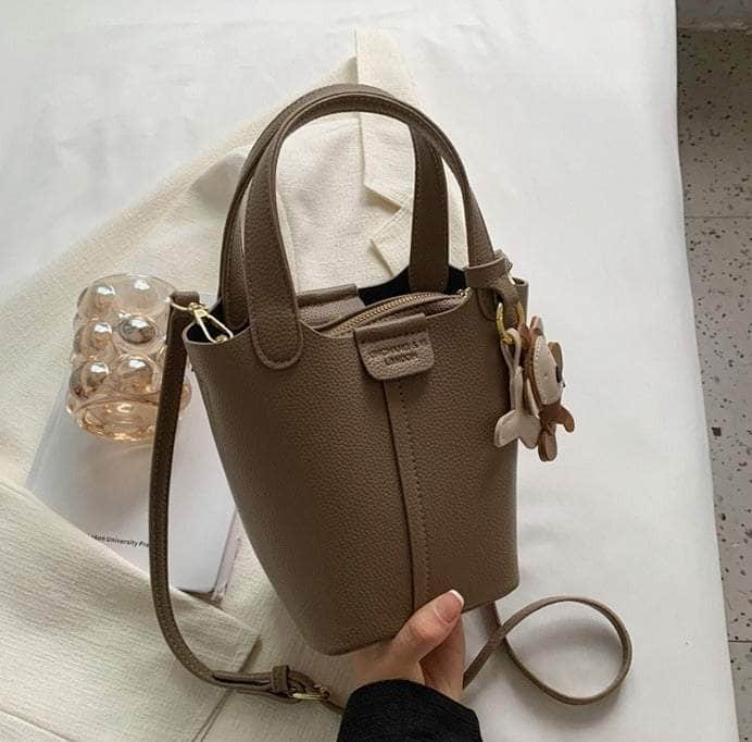 Sleek Crossbody Bucket Bag with Bear Charm Taupe