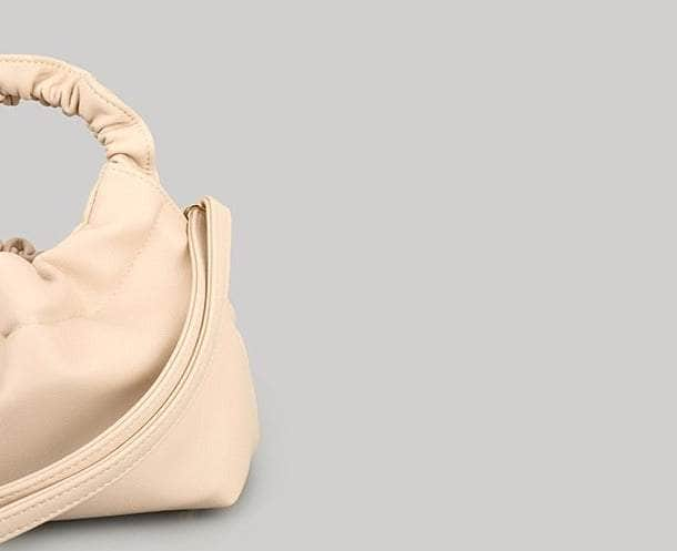 Sleek Leather Crossbody Bag with a Unique Handle Design