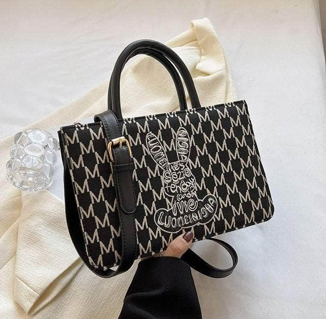 Sleek Shoulder Handbag adorned with Graphic Print Black