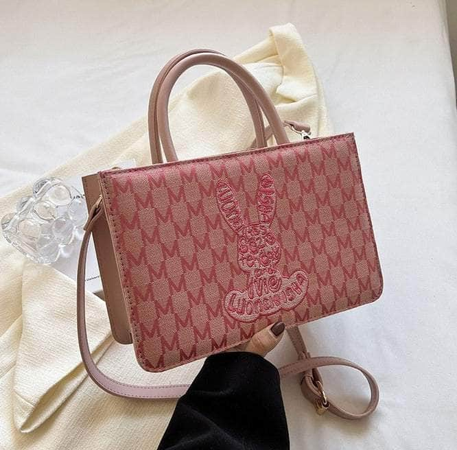 Sleek Shoulder Handbag adorned with Graphic Print Pink