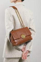 Vintage Flap Adorned Handbag with Chic Top Handle